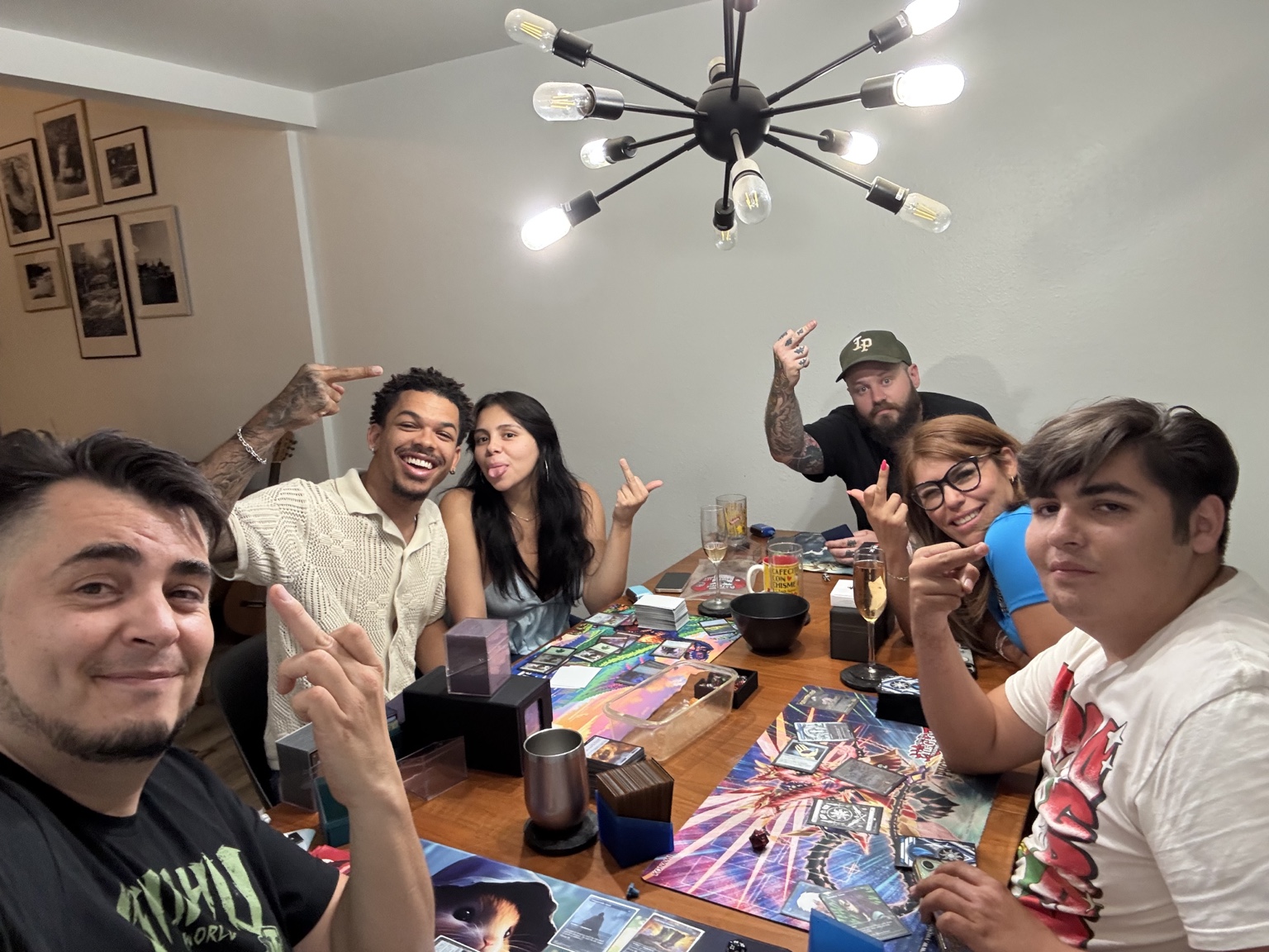 Friends gathered around a table playing cards