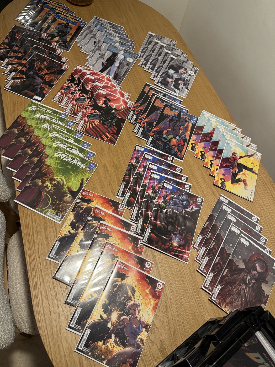 New comic inventory arranged on a table